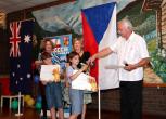 Perth - the Czech Consul General handing out a medal to Liam Červenka from the Czech School, Perth